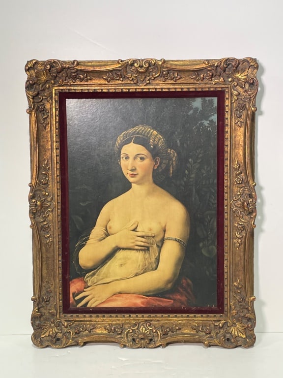 Portrait Print in Ornate Gilded Frame: Portrait print depicting a classical figure, mounted within an intricately carved gilded wood frame with ornate detailing. Inner border features deep red accents, enhancing the visual depth. Overall