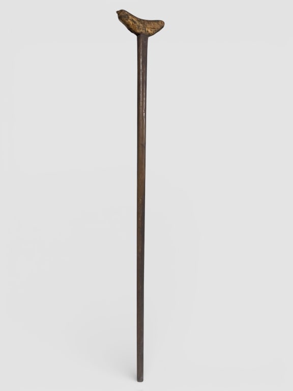 Early Crutch with Leather Covered Rest: Crutch, (Civil War), featuring a curved rest covered in leather. Measuring approximately 51 H, the crutch has a rounded shaft tapering towards the base. The leather covering on the handle exhibits