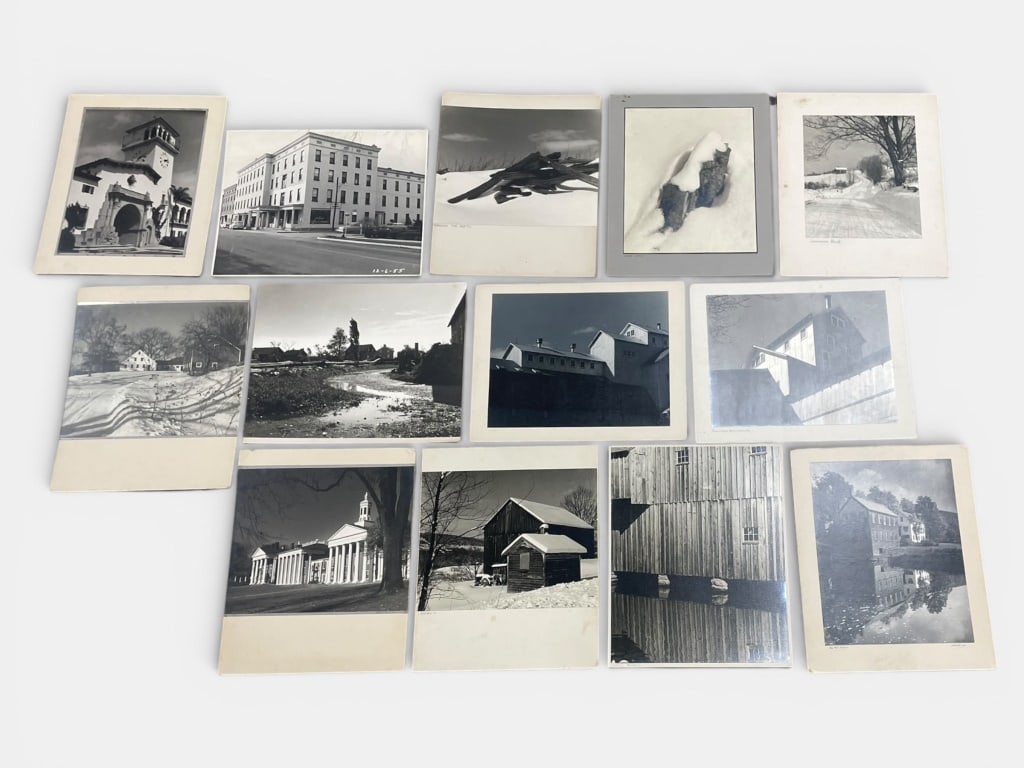 Silver Gelatin Photographs: Black-and-white photographs mounted on boards, showcasing rural and architectural scenes. Various exhibition labels and markings appear on the reverse of select mounts. Largest piece measures 16 W x