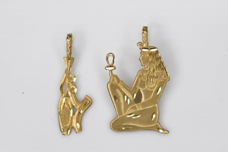 14K Gold Charms 7.59g: Includes 2 charms including a an Egyptian goddess. Both pieces measure approximately 1.5"L.