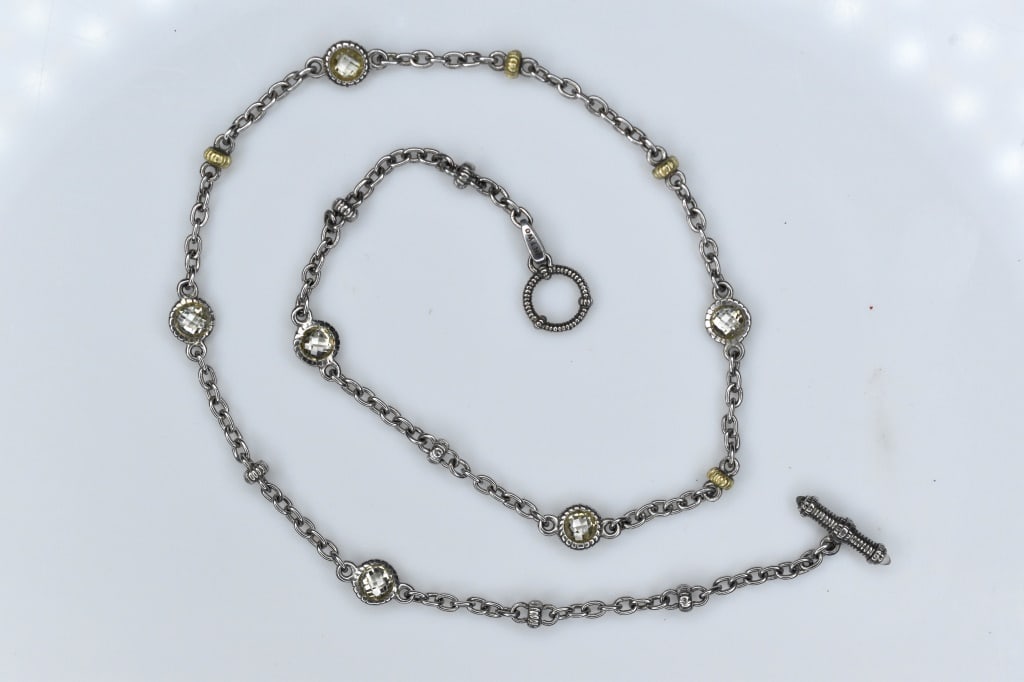 18K Gold and Sterling Necklace 13.62G: A nice sterling silver and 18K gold necklace with crystal and gold stations measuring approximately 17"l.
