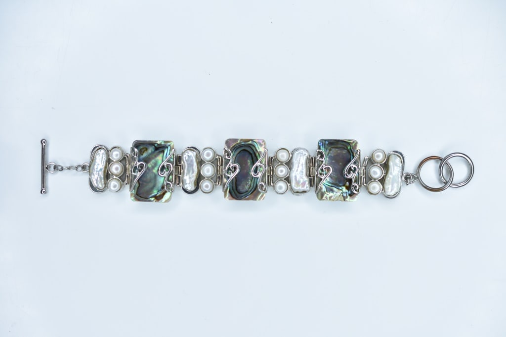 Sterling Silver and Pearl Bracelet 1.73ozt: Sterling Measures approx. 8.5" long 1.73ozt