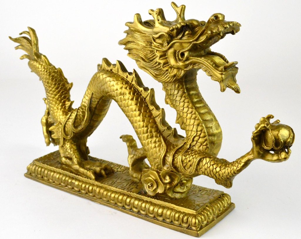 Chinese Brass Dragon: Chinese Brass Dragon holding Fireball, Statue. Marked on Bottom. Approximately 13L x 7"H"
