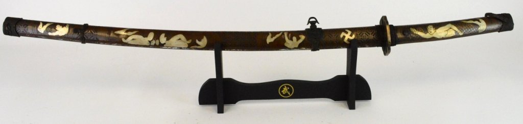 Japanese Sword with Nude Figures and Wan Symbol: Handmade Japanese Sword with Nude Figures and Wan Symbol. Approximately 40" overall in sabre, stand for display only