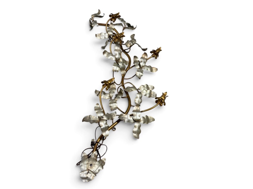 Sculpted Metal Wall Lamp With Floral Design: Mid-century metal wall lamp with curling floral and leaf motifs in silver and gold tones. Features stylized branches and decorative embellishments. Measures approximately 59 inches tall and 21 inches 
