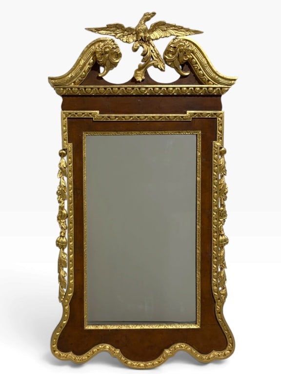 Antique Federal Mahogany Giltwood Mirror 1830-1840: Exquisite Federal-style mirror, (circa 18301840), featuring a wood frame with gold gilt detailing and ornate carvings. The centerpiece is a detailed Phoenix Bird crest atop scrollwork. Mirror measures