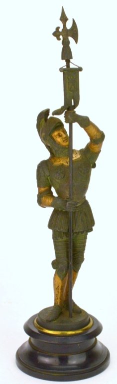 Antique Spelter Guard Garniture: On original Ebonized base, depicts guard with Polearm adorned with Heraldic Flag. Retains original paint. measures 19"