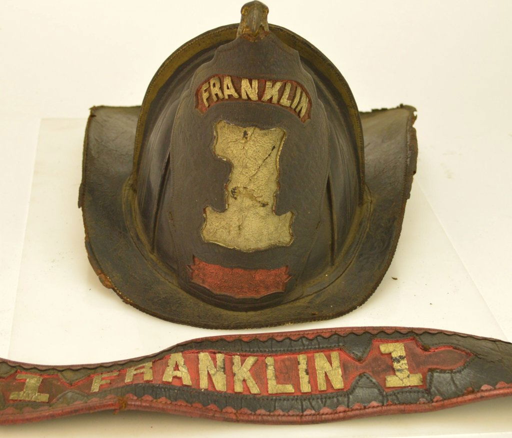 Wilson High Eagle Fireman's Helmet and Parade Belt: 19th Century Fireman's Helmet from Franklin Fire Co. Easton PA. Maker Wilson, Frame seems to be missing. Parade belt is complete. Also has original buckle marked 1852, with the 1 missing. The lot disp