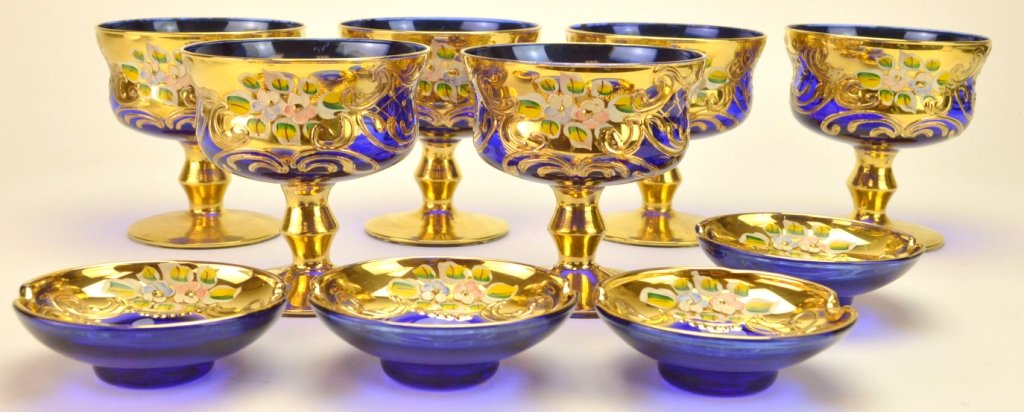 Mario Sanzogno Murano Glass Grouping: Includes 10 pieces of vintage Mario Sanzogno cobalt blue gilt and enamel decorated Murano glass. Includes 6 goblet type glasses and 4 ashtrays