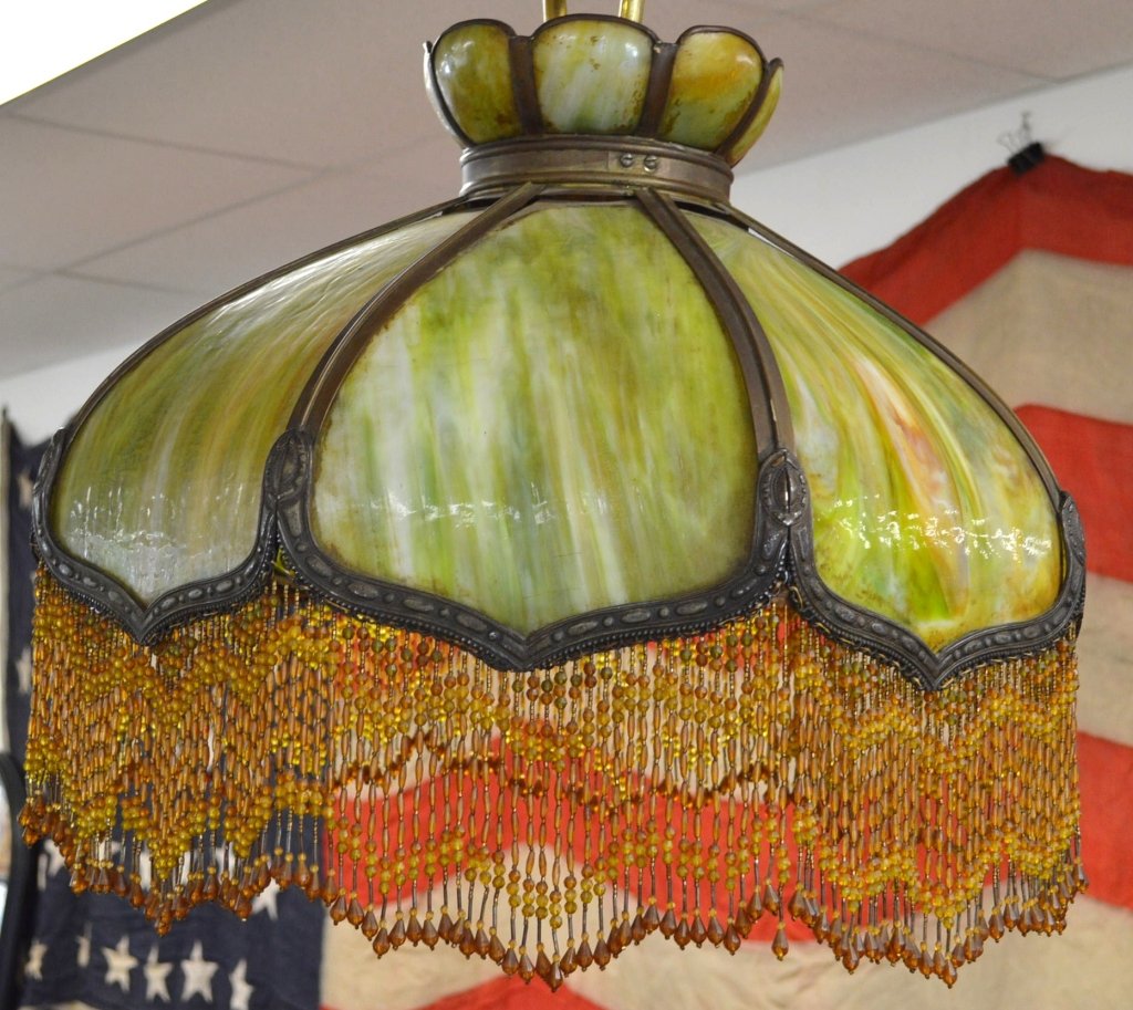 Antique Hanging Slag Glass Lamp: A fine ceiling lamp fixture with a three light socket and all original slag glass panels. There is some loss to fringe and hanging bead work. Turn of the century.