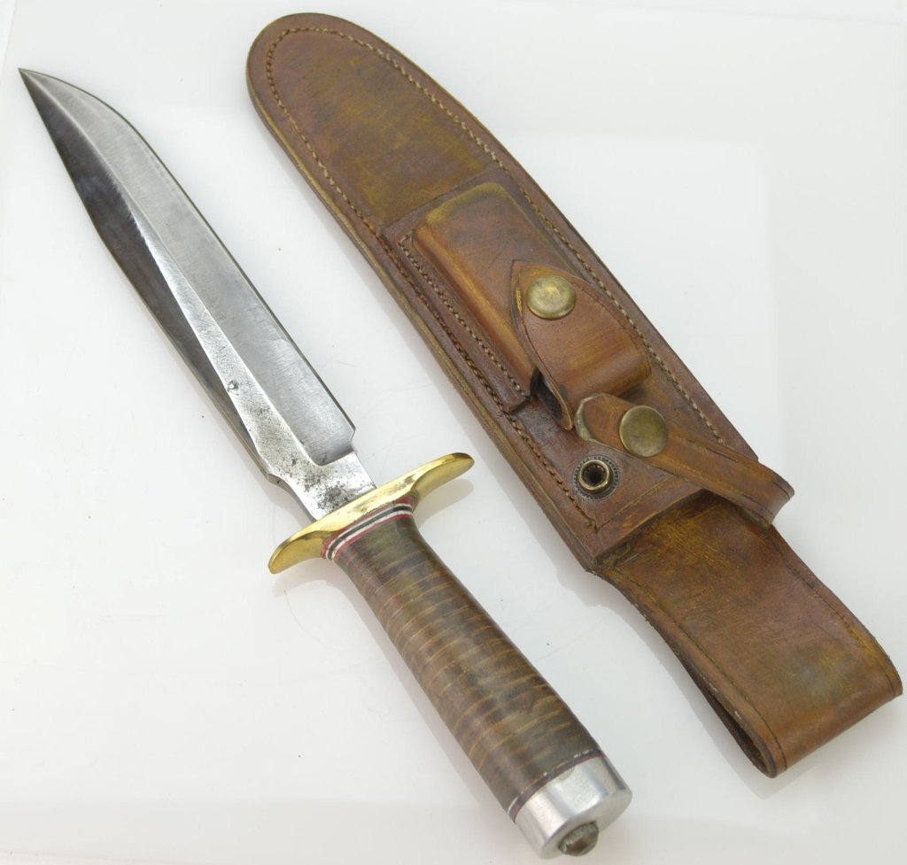 Randle Type Fighting Knife: Knife and Sheath both stamped "Randall made Orlando Fla", measures 12.5" Knife and Sheath both stamped "Randall made Orlando Fla" 12.5" there has been discussion on this randall knife that it is possi