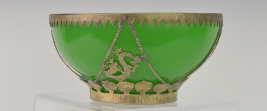 Chinese Emerald Green Jade Bowl: Chinese Emerald Green Jade Bowl with Silver Overlay including 2 Scrollwork Dragons. Chop Mark on bottom. Circa 1890. 4 1/4" Diameter x 2 1/4" High.