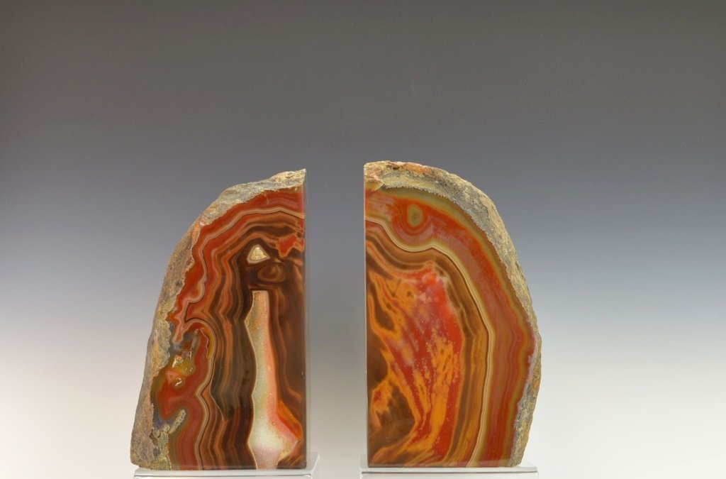 2 Thick Agate Geode Bookends: 2 Thick Cut Natural Brazillian Agate with Druzy Bookends. (1) 6 3/4" High x 4" Wide x 3 3/8" Thick, 2,938 grams. (1) 6 3/4" High x 4" Wide x 3 3/8" Thick, 2,973 grams.