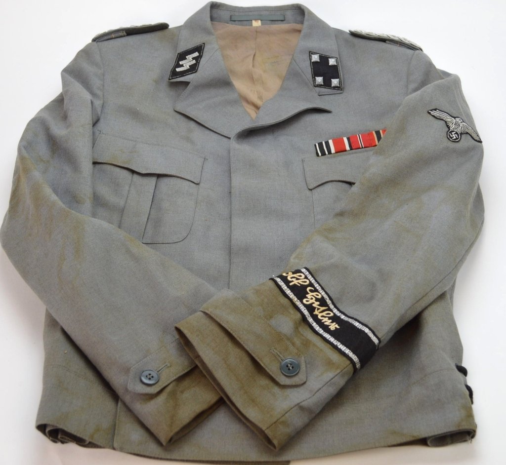 WWII German Military SS Coat: Wool coat, WWII German Military SS, with some patches insignias and staining to sleeves. size 40