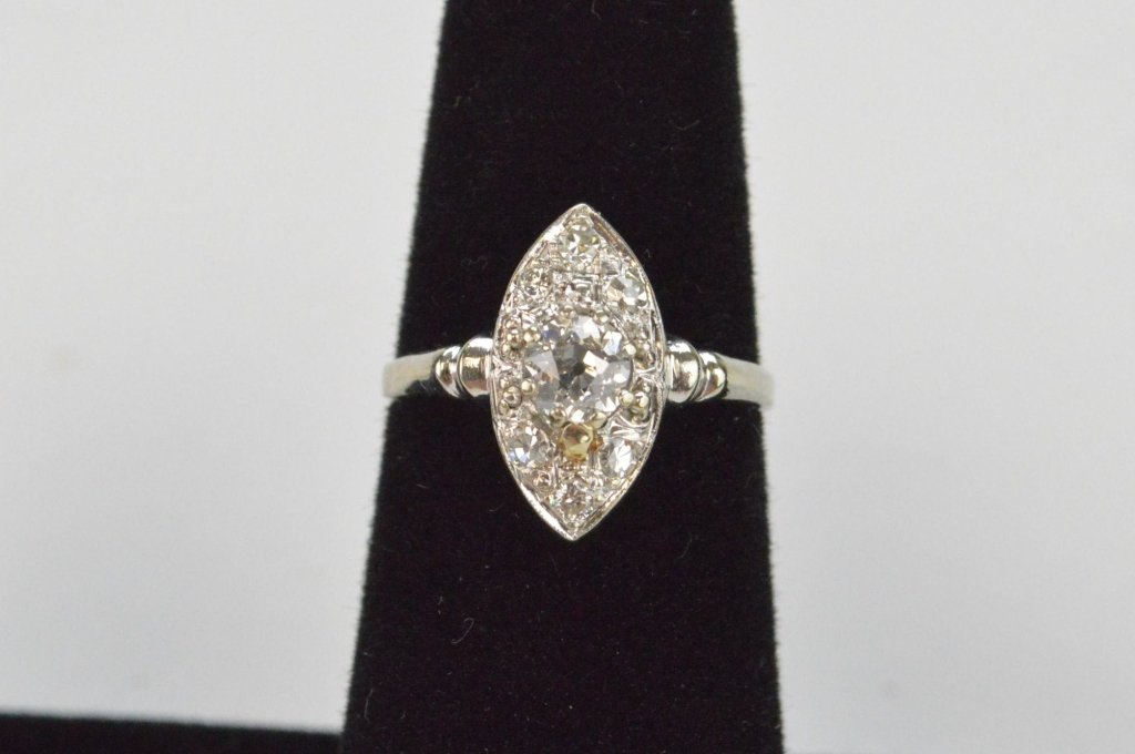 14k WG Old European Cut Diamond Ring: This beautiful vintage style ring contains a .33 carat Old European Cut center stone H-SI2, with 6 single cut diamonds = .10 cts g/vs set in 14k white gold. 1.6 dwt total weight. Comes with cert.