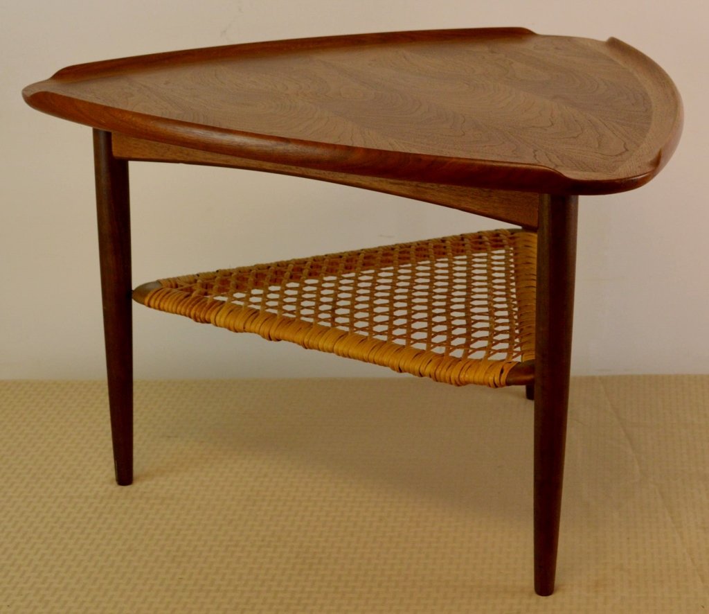 Poul Jensen Mid Century Modern Table for Selig, Denmark: Poul Jensen occasional table, for Selig, Denmark, teak, triangular top with raised lip to edges over a caned lower shelf, original finish, Selig metal decal, 26"dia. x 17"h, has one water ring, and no