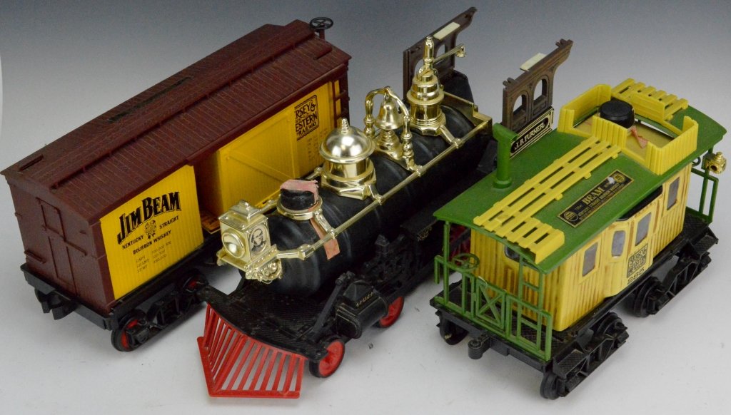 Jim Beam Railroad Decanter Grouping: Includes (3) Jim Beam Whiskey Decanters, Jersey Western boxcar, JB Turner locomotive and Jersey western caboose.