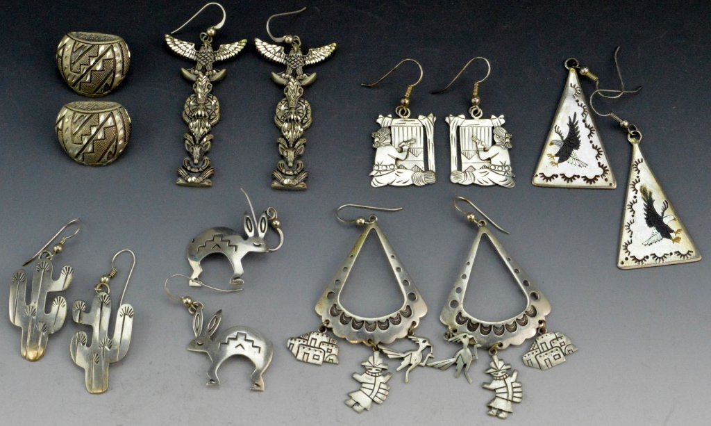 Signed Navajo Sterling Earring Grouping: Includes (7) pairs of signed silver earrings. The basket form measures .75" and is signed SC Sterling, the totems measure 2" signed SC sterling, the figural pair of a woman measure 1" signed BB sterli