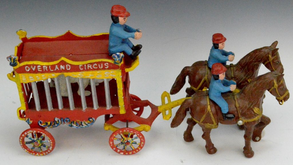 Overland Circus Bear Cage Cast Iron Grouping: Includes a cast iron Overland Circus bear cage measuring 16" and and a cast iron ladder truck measuring 30"