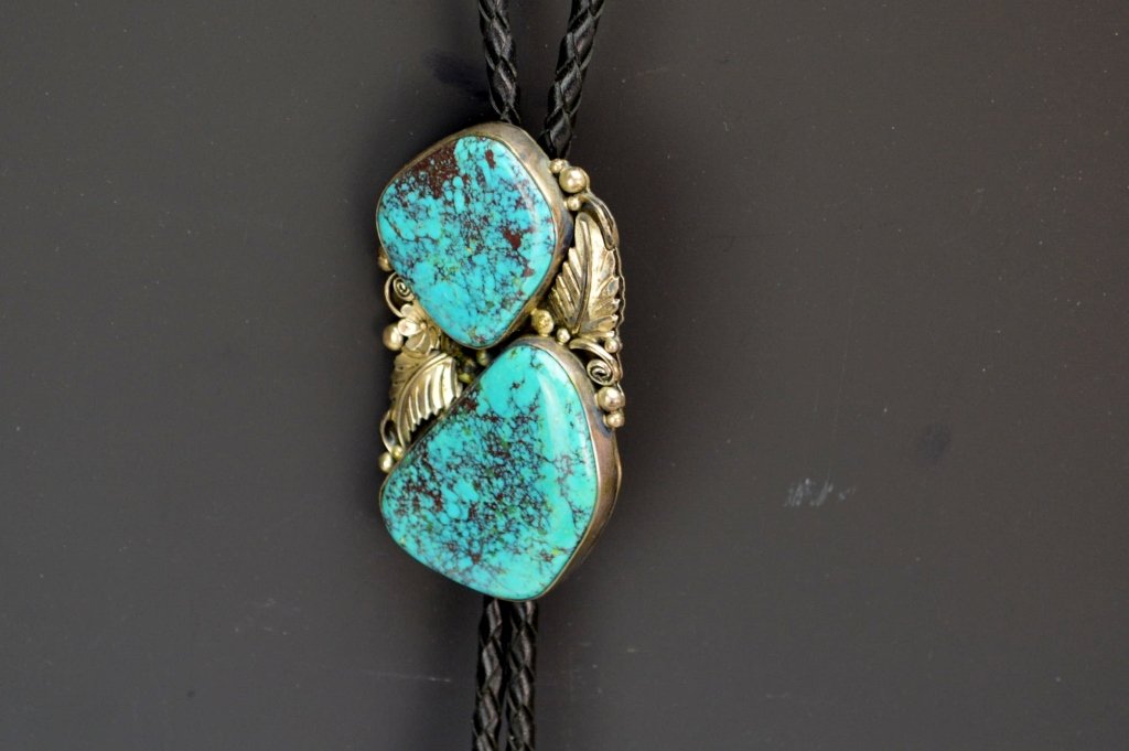 Navajo Sterling Silver Turquoise Bolo Tie: Large Navajo sterling silver and turquoise bolo tie, measures 2.875" hallmarked sterling and initialed with a J
