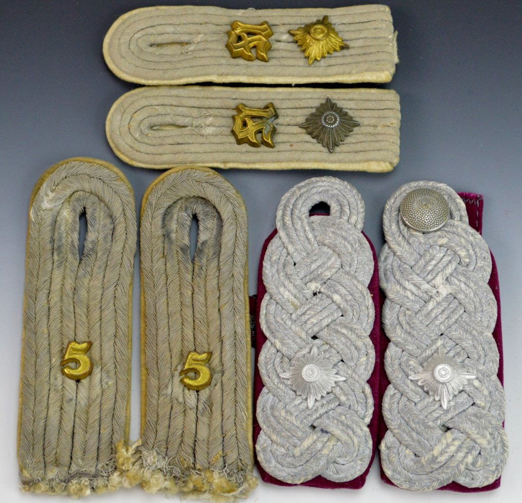 German WWII Shoulder Board Grouping: Includes (3) pairs, Heer army hauptman with gilt and alloy pip and medical school cypher on white background, hauptman infantry shoulder board with 5 cypher on white background, and Army shoulder boar