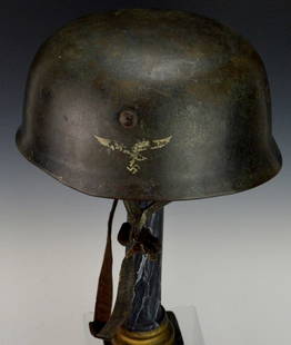 German WWII M38 Paratroopers Helmet: WWII M38 Paratroopers "Fallschirmjager" helmet. Made in 1939 at the Eisenhuttenwerke factory in Thale Germany. Has spanner bolts, original liner. Size 68 helmet, smaller liner but appears to be done d