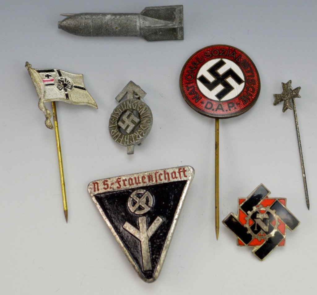 German WWII Pin Grouping: Includes TeNo (technical emergency) Corps pin, Hitler youth proficiency badge, iron cross stick pin, bomb stick pin, National Socialist DAP enameled member pin, NS-Frauenschaft enameled member pin, an