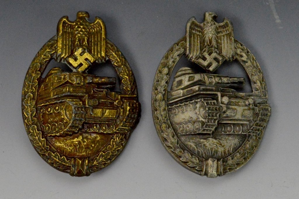 German WWII Panzer Badge Grouping: Includes (2) German WWII Panzer Assault badges, one in silver and one in bronze. Bronze marked 1942 A.W.S