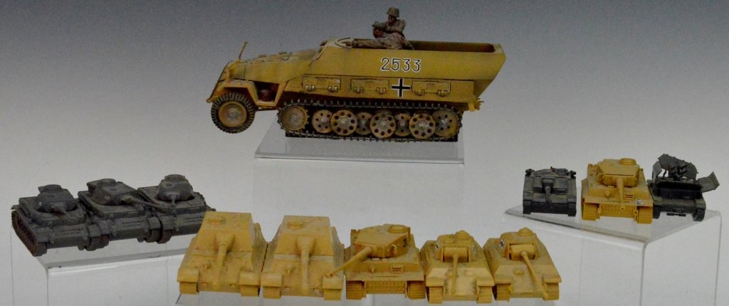 Forces of Valor Transport Grouping: Includes Hanomag Sd.Kfz.251 Schutzenpanzerwagen Diecast ModelGerman Army, #2533, Eastern Front, 1944, unboxed. Also includes (3) Corgi Diecast Panzer IV tanks and assorted DBGM plastic tanks