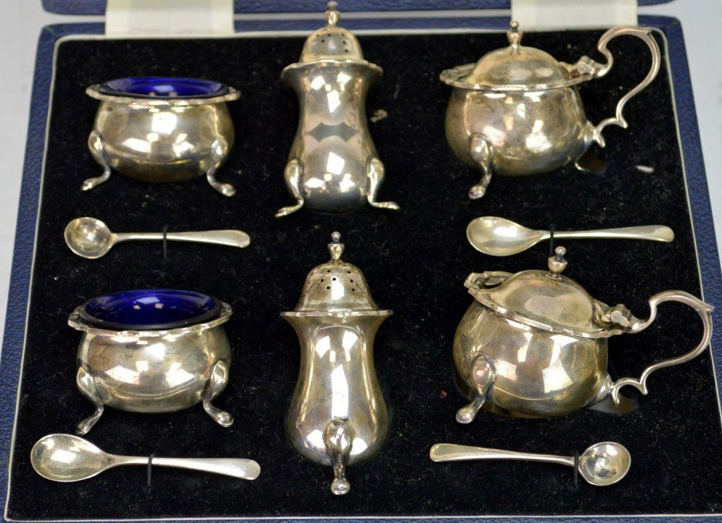 Happin and Webb Sterling Silver Salts Set: Includes (2) open salts with cobalt blue inserts, (2) salts with lids and cobalt blue inserts, (2) shakers, and (4) spoons. Includes original fitted box.