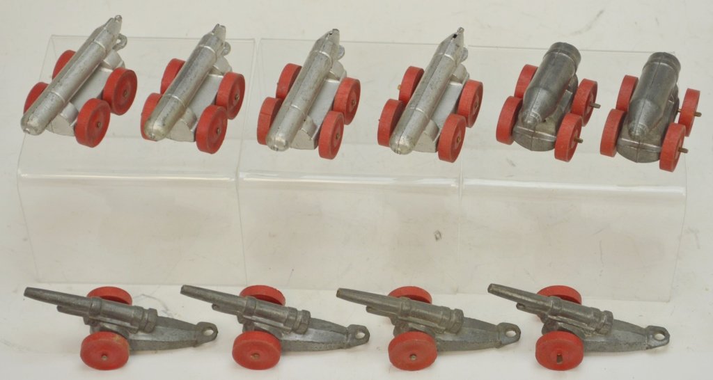 Barclay Manoil Lead Ordinance Grouping: Includes (4) lead howitzers, (4) torpedos, and (2) bombs. All pieces have original red wooden pools.