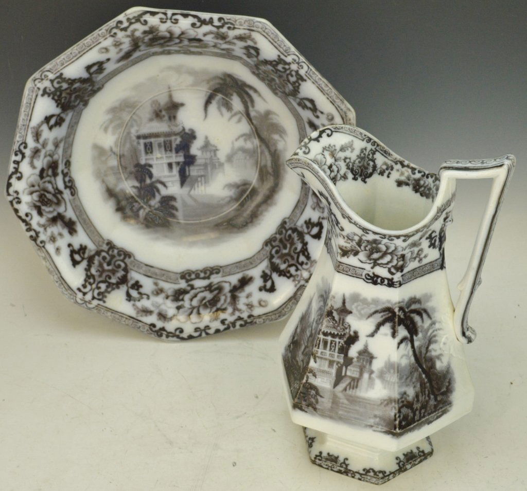 Pitcher and Wash Basin, Ironstone Davenport: Black or dark flow blue in Cypress pattern. Set is over 100 years old. Cityscape with floral design. Pitcher measures 12" tall, basin measures 13.75" diameter.