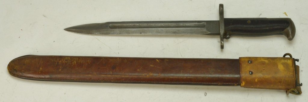 M1 Bayonet and RIA Scabbard: M1 bayonet blade marked PAL U.O.S. and measures 10" and an RIA scabbard dated 1908/1921 measures 17"