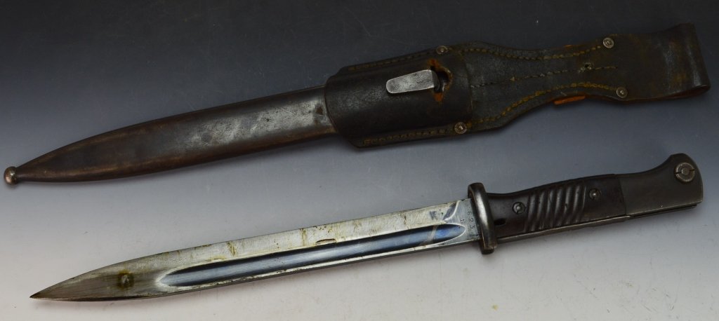 German Military WWII K98 Bayonet: Includes frog and sheath, serial numbers match blade and sheath. Made in Coppel, 1940. Sharpened blade.