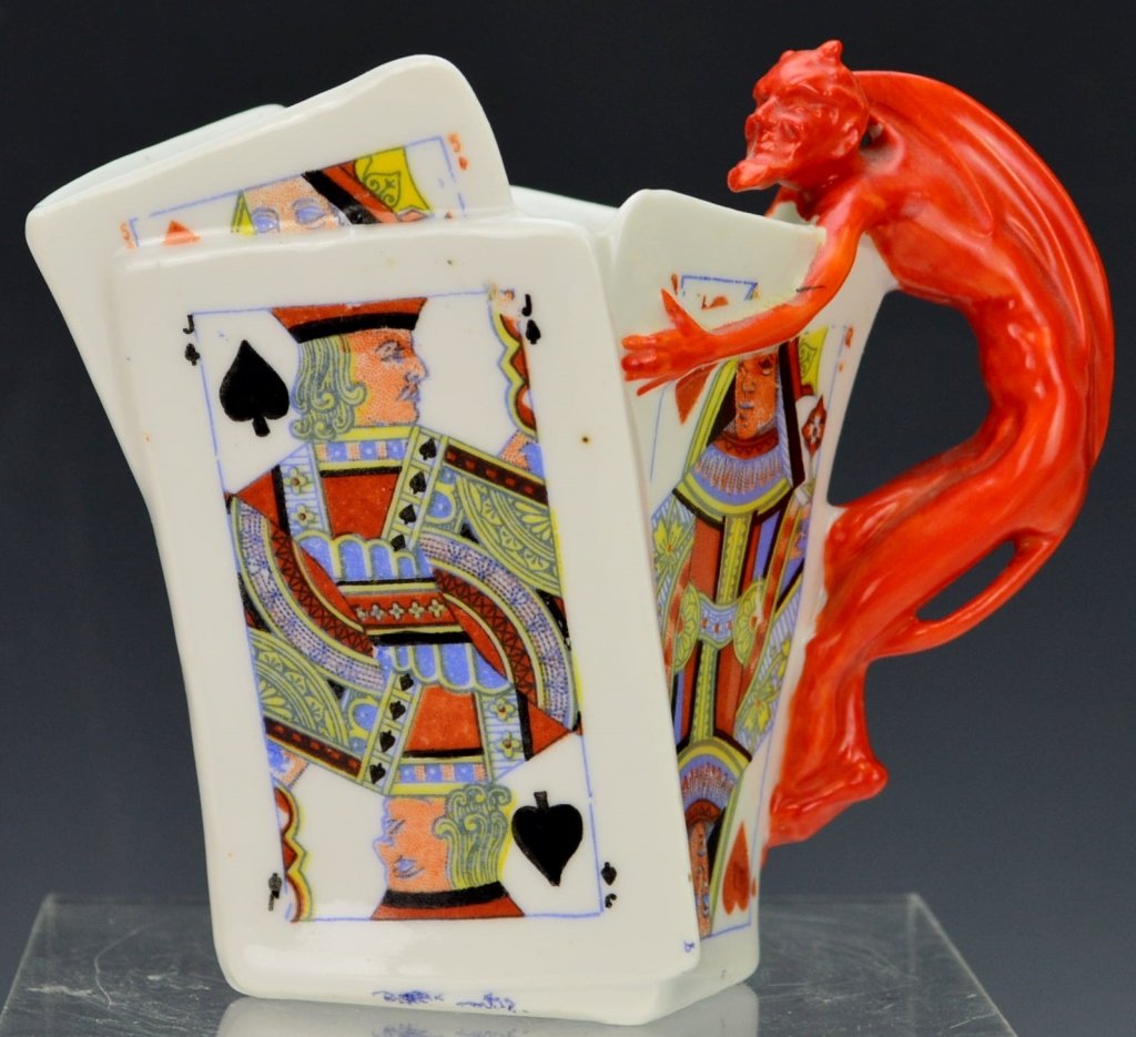 Royal Bayreuth Playing Card Creamer: Marked "ROYAL BAYREUTH BAVARIA P. T. (Tettau Porcelain Factory W. Germany)." The cup is in excellent condition, free from chips, cracks, hairlines, or restoration. Vibrant colors. Measures 4" tall.