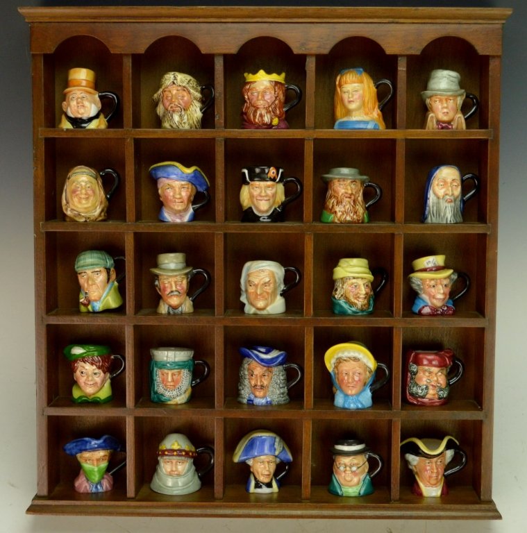 Miniature Character Toby Mugs in Display: Set of twenty-five (25) P. Jackson miniature mugs in wooden display case. Set includes: Dick Turpin, Henry V, Hornblower, Mr. Pickwick, Tom Jones, Peter Pan, Ivanhoe, Captain Hook, Moll Flanders, Fals