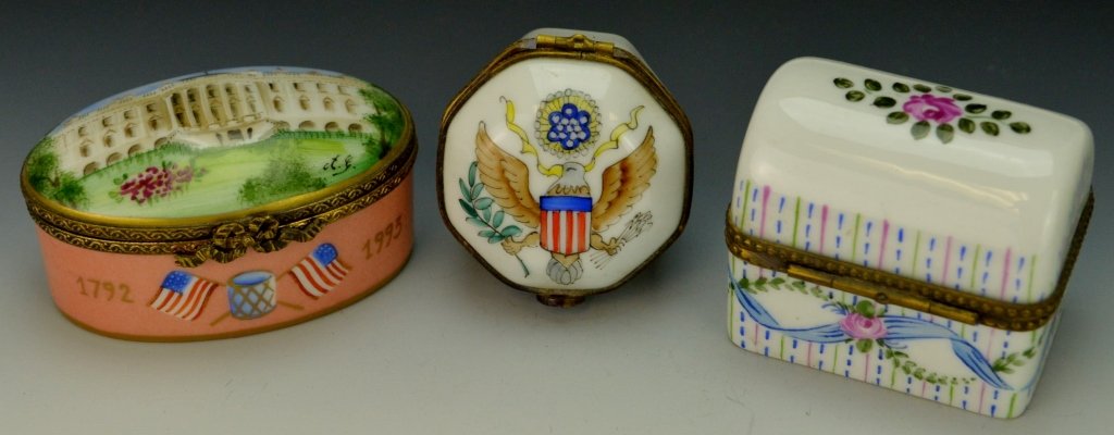 Limoges, France Peint Main Trinket Boxes: Includes three porcelain pill or snuff boxes. Oval marked 73, and measures 2.25"; Square marked Peint Main with floral pattern and horseshow clasp; Octagon with U.S. Presidential seal on lid.