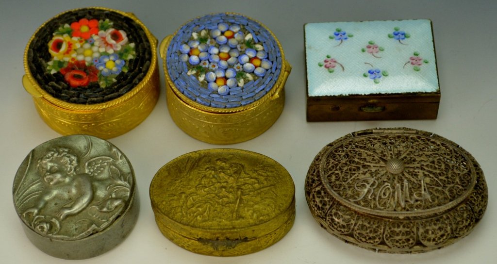 Silver Trinket Boxes Grouping: Includes six (6) small lidded metal pill or snuff boxes. Two rounds have porcelain lids and are stamped ITALY. Oval is stamped ITALY. Square with enamel lid. Round with cherub lid. 800 silver oval fil