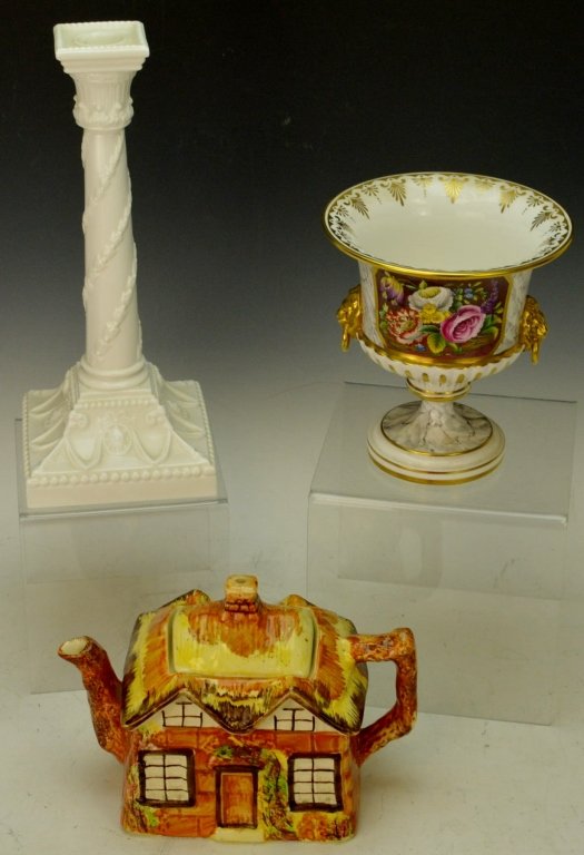 English Decorative Porcelain Grouping: Ye Olde Cottage teapot by Price Bros., measures 5.5" tall. Royal Worcester white candlestick, measures 11" tall. The Worcester Collection lion's head handles footed bowl, measures 6" tall. All made in