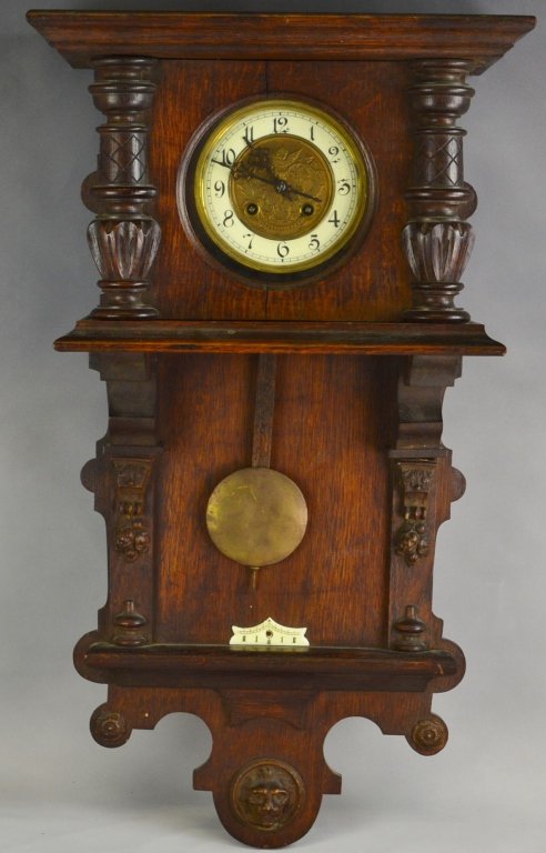Large Ornate Wall Clock: It has its pendulum and key. The measurements are 29 1/2" x 16".