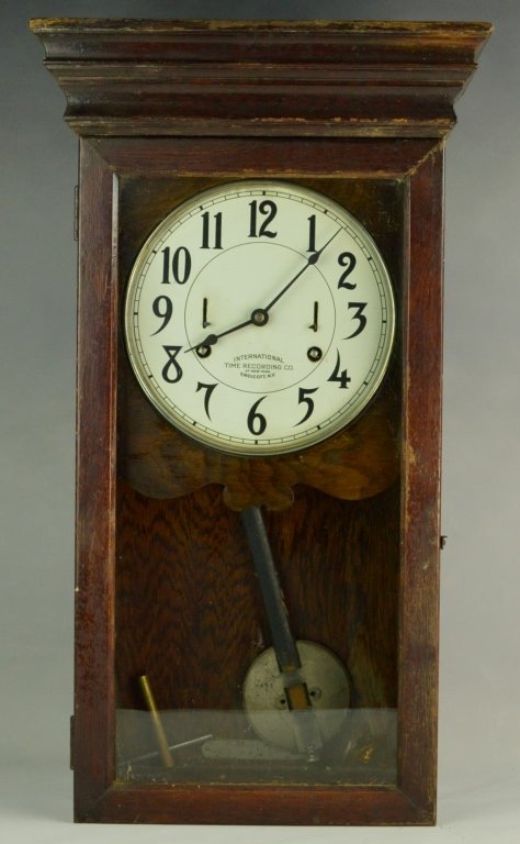 International Time Recording Co. Wall Clock: It measures 30" x 17" and it has its pendulum and key.