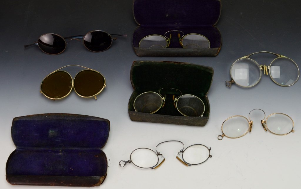 Early Pince Nez Spectacles Grouping: Includes (7) pairs of early spectacles including pince nez type spectacles. One pair is folding.