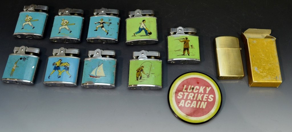 Amico Lighter Grouping: Includes (9) Amico lighters (baseball, basketball, sailing, boxing, etc. Lucky strikes again pin, LDL Zippo type lighter.