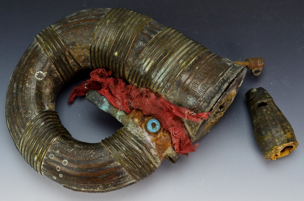 18th century Persian Powder Horn: 18th-mid-19th century Islamic Persian Powder horn with inlaid blue stone and intricate line designs. It is missing the Powder measurer, and funnel is present but unattached. Measures: 5â€x5â€�
