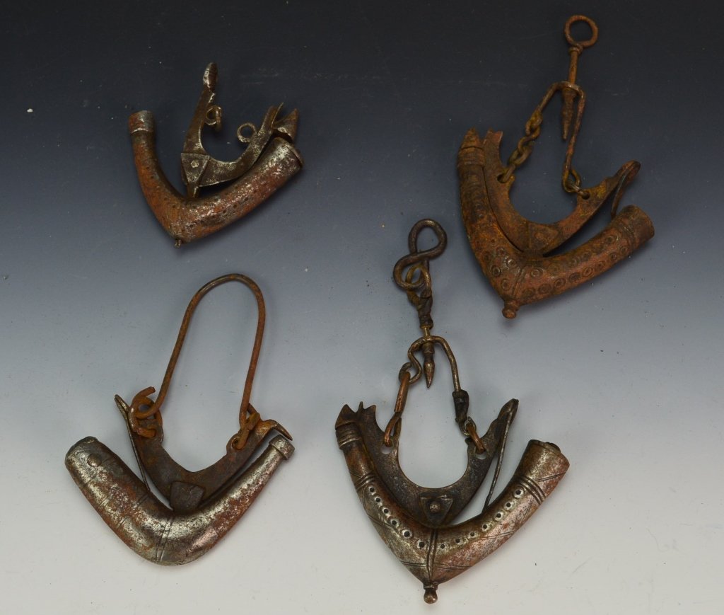Persian Gunpowder Horns: Lot of (4) Persian Gunpowder horns circa mid-19th. Each have various tribal and Islamic designs. All measure approx. 3â€
