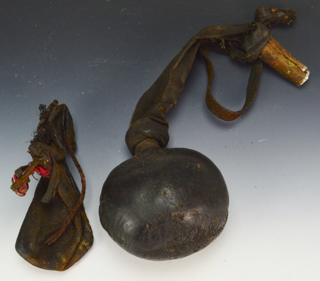 Islamic Powder Gourd: Islamic Powder leather covered gourd with cloth funnel and funnel tip. Tip has been replaced. Includes small leather pouch. Measures: 12â€ x 3.5â€