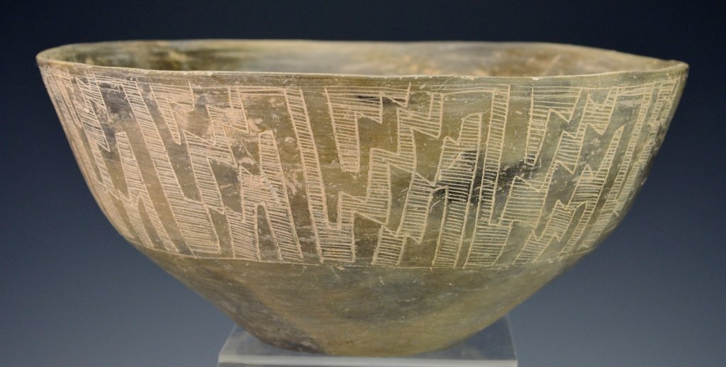 Argentinian Pottery Vessel : Sotheby's: Circa A.D. 400-700. Vessel with small flattened base, flaring body and incised on the exteriorwith a frieze of angular geometric motifs. Diameter 8.875". Provenance: Sotheby Parke Bernet 4/18/73 Aucti