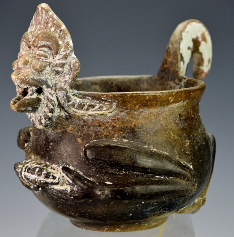Mayan Blackware Effigy Bowl, Highlands : Sotheby's: Late classic, c. 550-950 A.D., the footed vessel molded in the form of an aged monkey, possible God N, with curling upturned tail forming a handle and tightly bent legs at the sides, both hands graspi