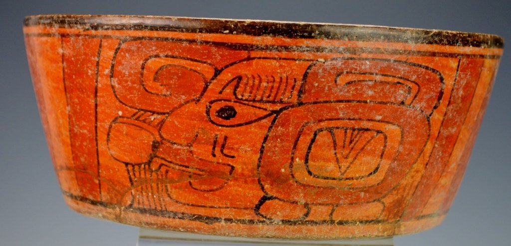 Mayan Flat Bottom Orangeware Bowl : Christie's: Late Classic Maya, Yucatan, Mexico A.D. 900-1100, A flat - bottom with sharply flaring sides, black and red designs on orangeware painted around sides with three "speaker" glyphic faces alternating wi