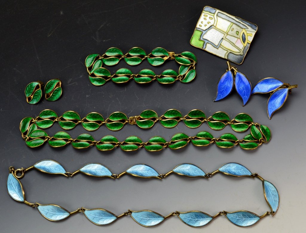 David Anderson Sterling & Enamel Necklace Lot: A lot consisting of (2) necklaces, (1) brooch, and (2) pairs of clip on earings All in a floral design. Makes (2) sets plus the brooch. Brooch measures 1.75" x .75" Blue floral necklace measures 21.25